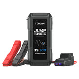 Black portable jump starter with red and gray clamp cables, display screen, and accessories on white background.