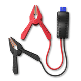 Two battery clamps in red and black with attached cables connected to a black connector box with blue terminals.