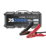 Black and gray portable jump starter with red and black battery clamp cables attached.