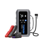 Gray portable jump starter with digital display, control buttons, red and black battery clamps, and attached cable.