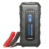 TOPDON V2200 jump starter with battery percentage display, power button, and red and black clamps attached.