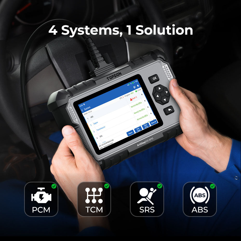 Mechanic using the TOPDON ArtiDiag500 BMS OBD2 scanner for PCM, TCM, SRS, and ABS diagnostics