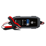 TB8000 battery charger with digital display and red and black clamp cables attached.